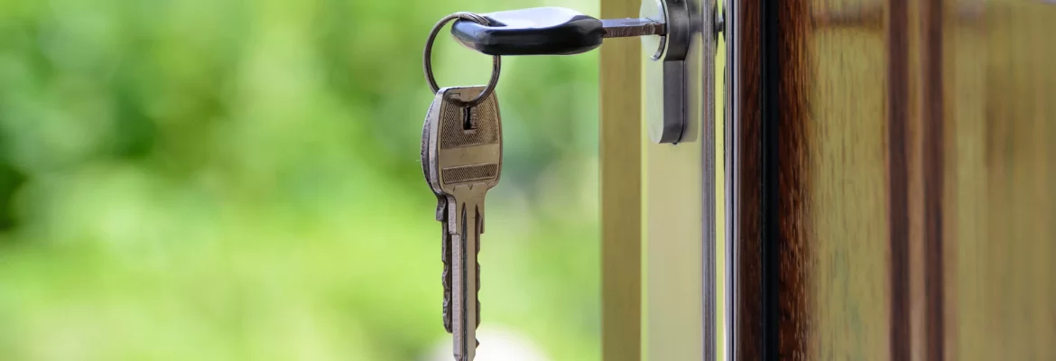 A closeup of a set of keys in a front door