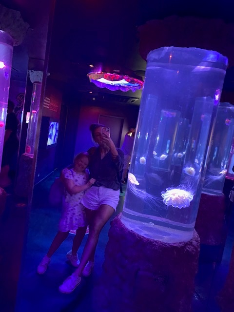 Rosie and Ash in the dark jellyfish room at Sea Life